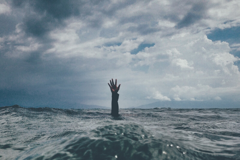 drowning in the ocean portraying frustration